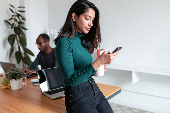 Office worker, looking at phone